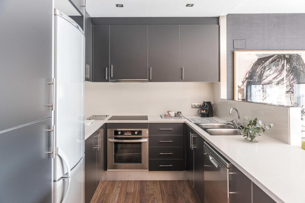 Kuchyň nebo kuchyňský kout v ubytování Casp 74 Apartments