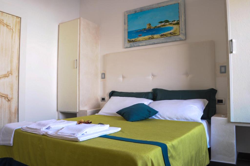 Postel nebo postele na pokoji v ubytování Baia Di Torre Squillace