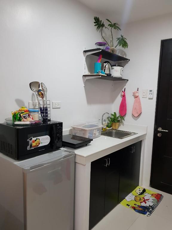 Kuchyň nebo kuchyňský kout v ubytování Cityscape Residences Unit 510
