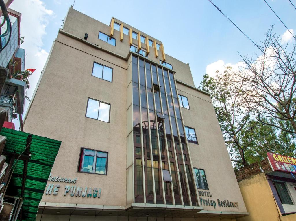 a building with a painting on the side of it at Hotel Pratap Residency-With early check inn in Rānchī