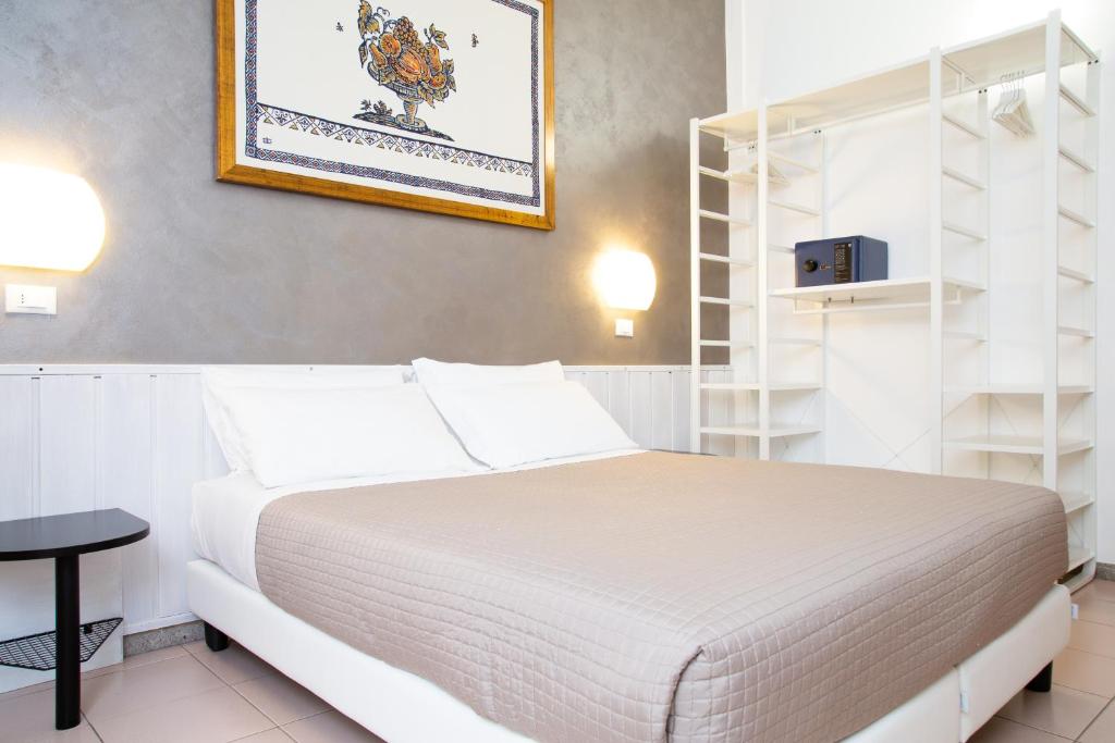 Posteľ alebo postele v izbe v ubytovaní Hotel Columbia