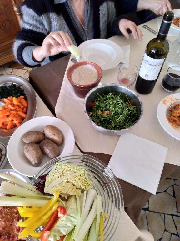 a table with a bunch of food on it at Hotel Banchetta in Sestriere
