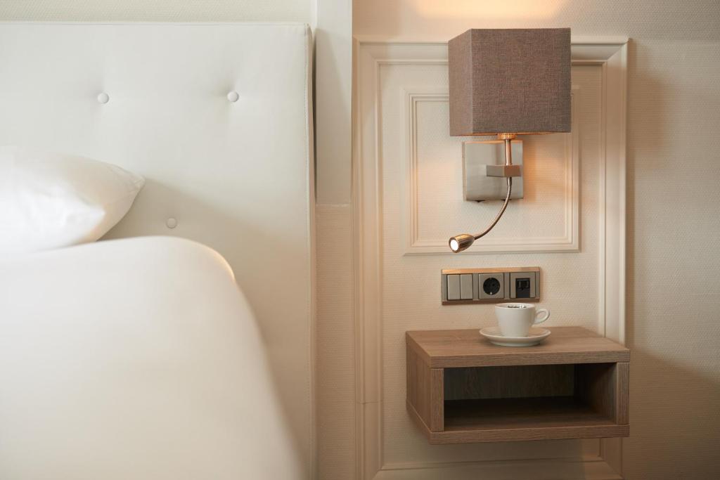 Postel nebo postele na pokoji v ubytování Hotel De Lindeboom
