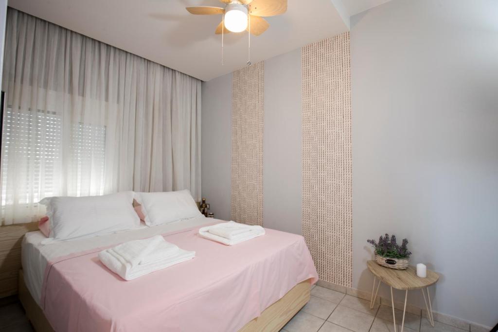 Postel nebo postele na pokoji v ubytování NK Apartments