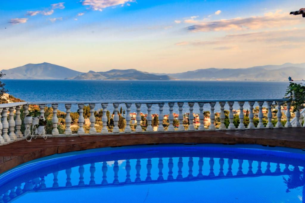 a view of the ocean from the balcony of a villa at Eva's Luxury Villa in Kritharia