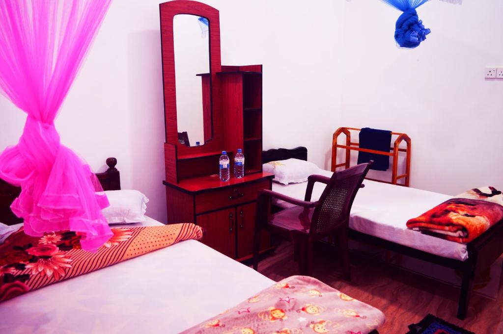 Postel nebo postele na pokoji v ubytování Subash Hotel