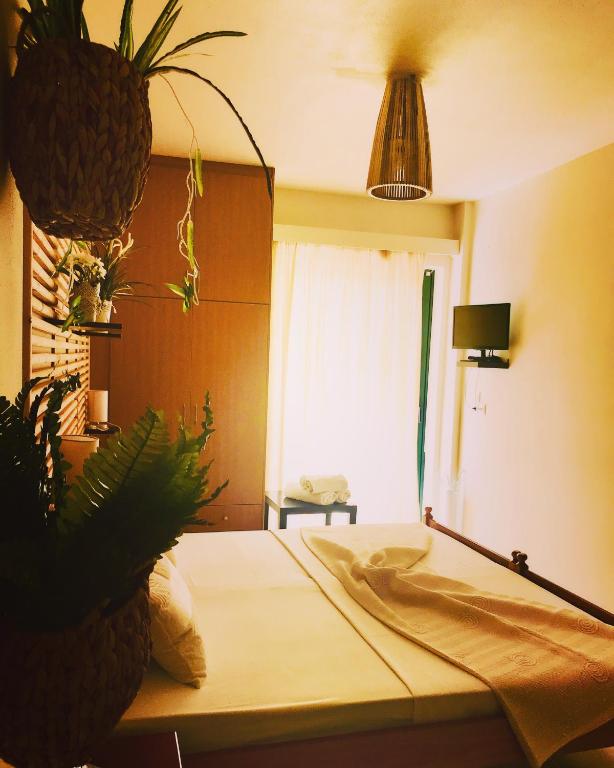 Postel nebo postele na pokoji v ubytování Sagini Boutique Hotel