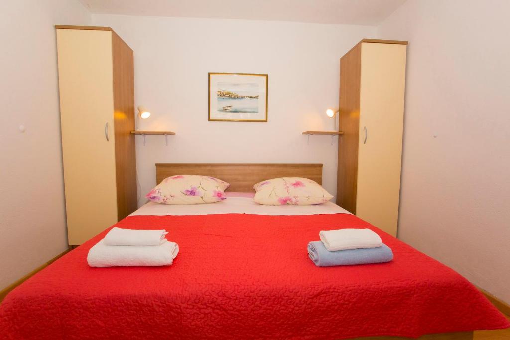 Cama o camas de una habitación en Apartments Blažević