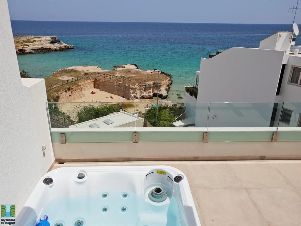 a bath tub with a view of the ocean at Anna's Luxury Apartments near the SEA in Monopoli