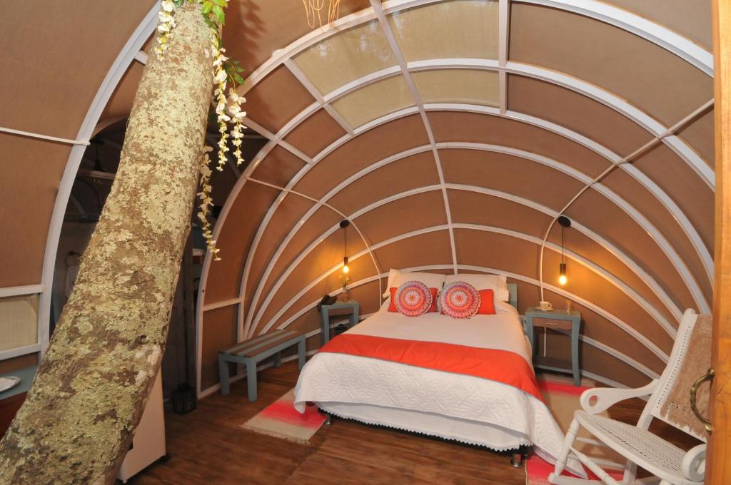 Postel nebo postele na pokoji v ubytování Hotel Casa Ambrosia