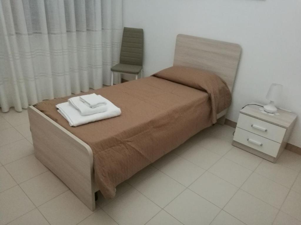Łóżko lub łóżka w pokoju w obiekcie B&B Nonna Lina