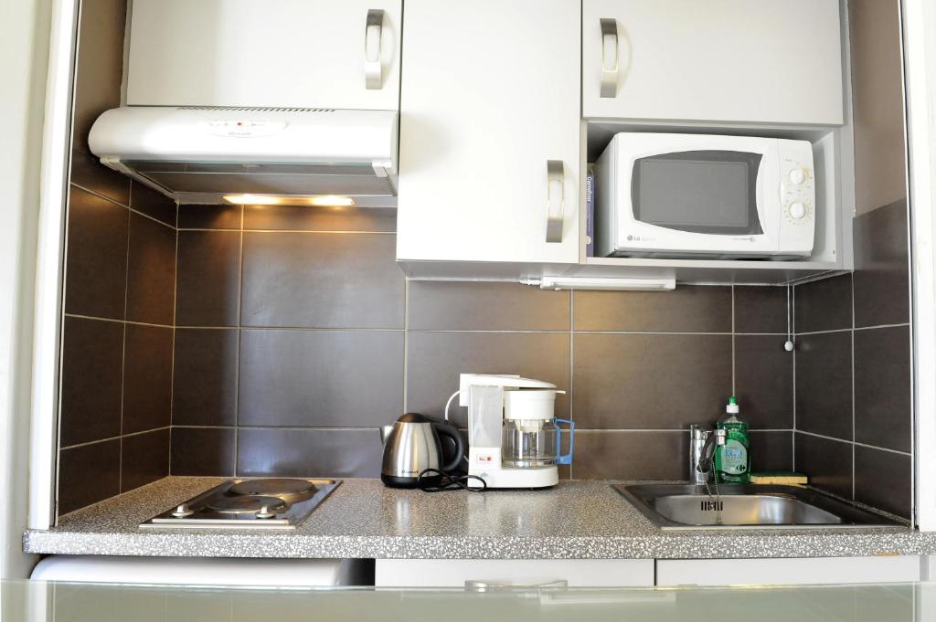 Kuchyň nebo kuchyňský kout v ubytování Hotel & Appartements Gochoki