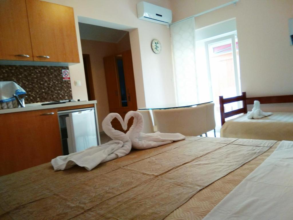 Postel nebo postele na pokoji v ubytování ApartHotel Viola