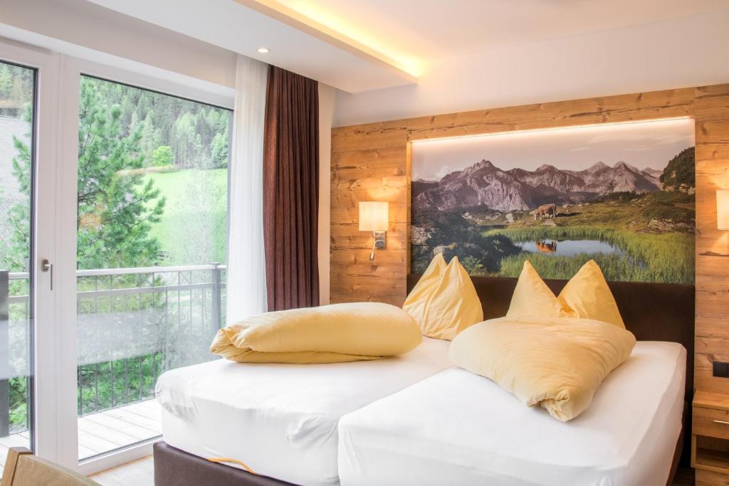 Postel nebo postele na pokoji v ubytování Appartements Hotel Gell