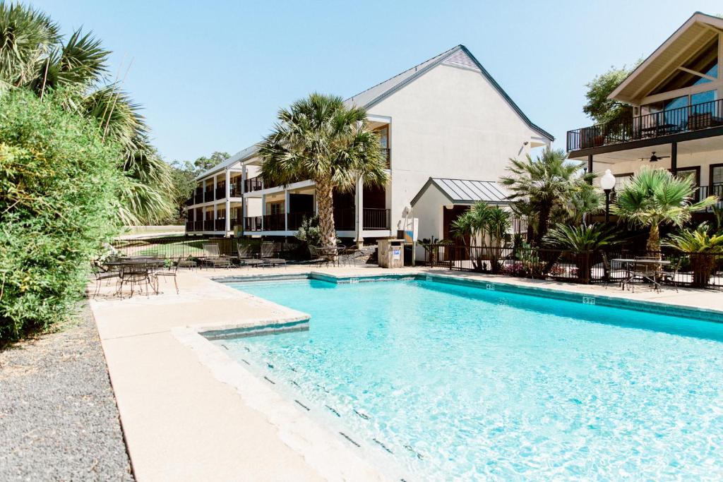 a swimming pool in front of a house at Hillside Boutique Hotel in Castroville