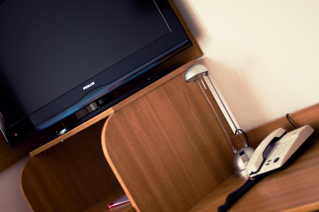 TV a/nebo společenská místnost v ubytování Hotel Est