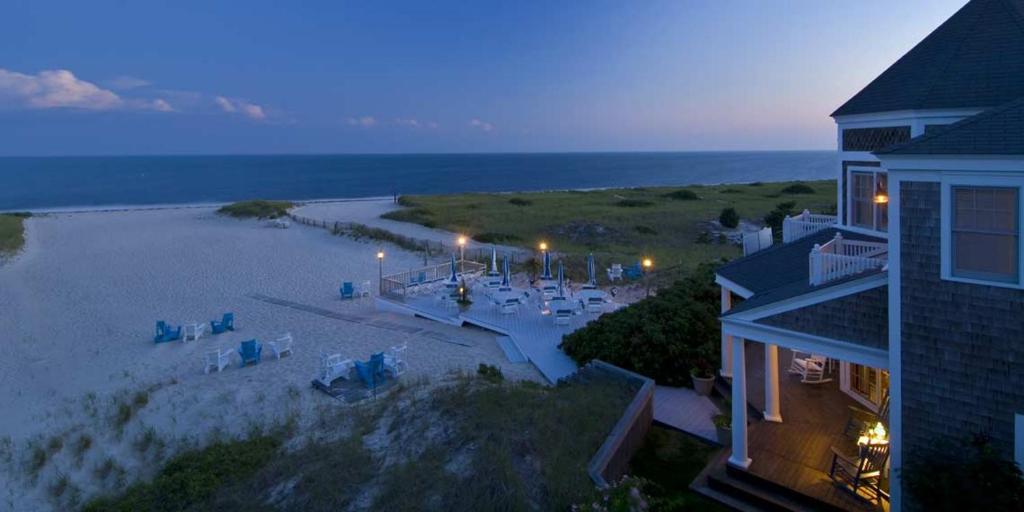 an aerial view of a beach with a house at Winstead Beach Resort in Harwich Port