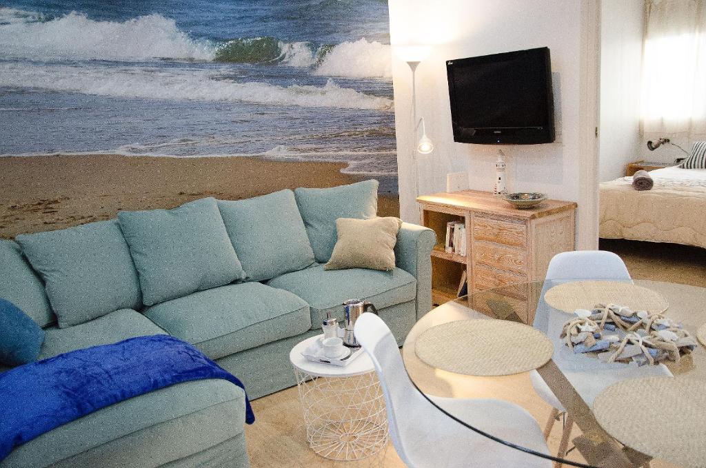 Televízia a/alebo spoločenská miestnosť v ubytovaní Oscar Apartment Sol