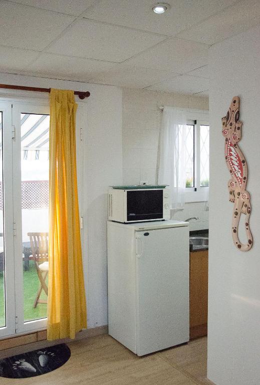 Kuchyňa alebo kuchynka v ubytovaní Oscar Apartment Sol