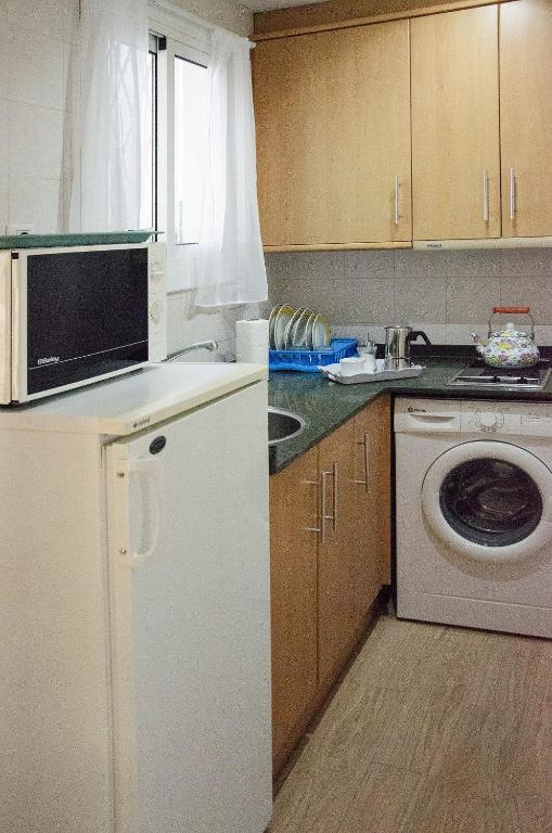 Kuchyňa alebo kuchynka v ubytovaní Oscar Apartment Sol