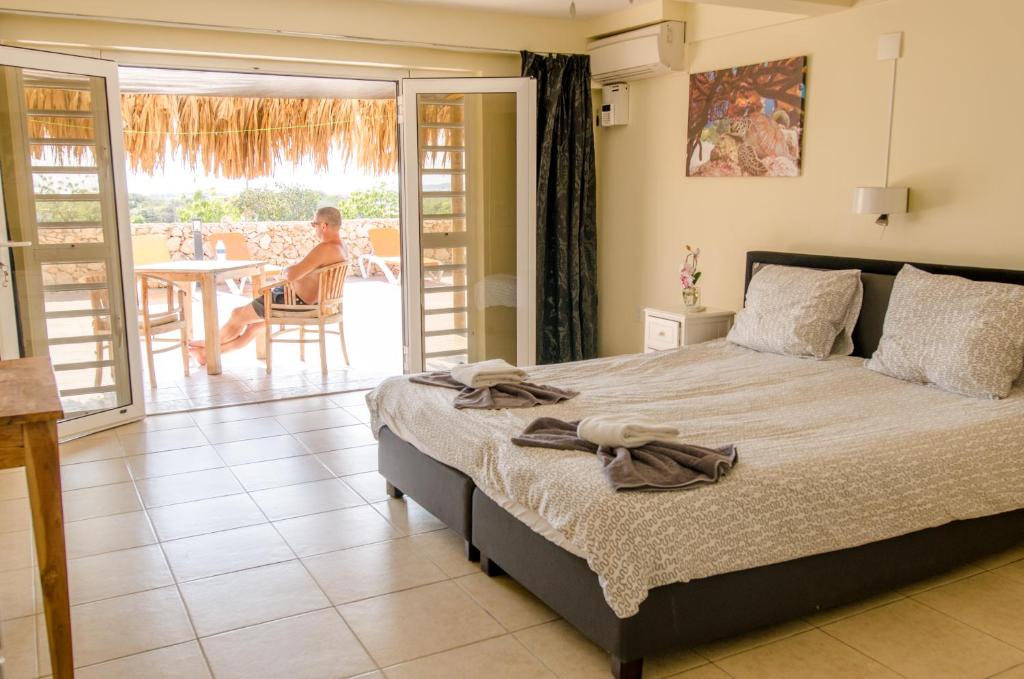 Postel nebo postele na pokoji v ubytování Hillside Resort Bonaire