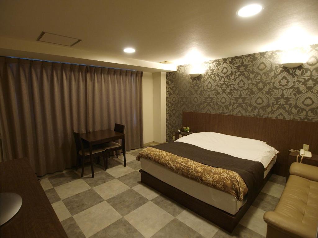 Postel nebo postele na pokoji v ubytování Hotel Le Mont (Adult Only)