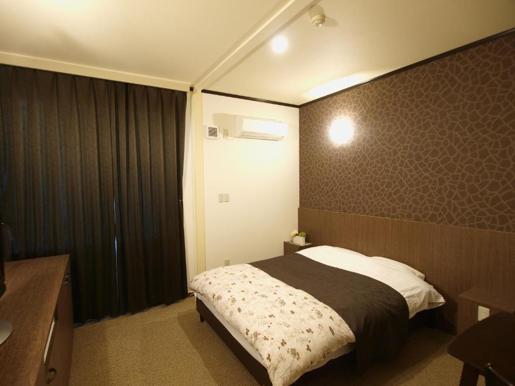 Postel nebo postele na pokoji v ubytování Hotel Le Mont (Adult Only)