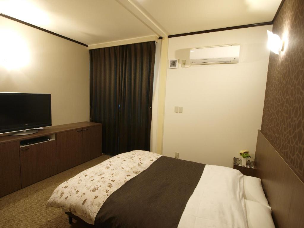 Postel nebo postele na pokoji v ubytování Hotel Le Mont (Adult Only)