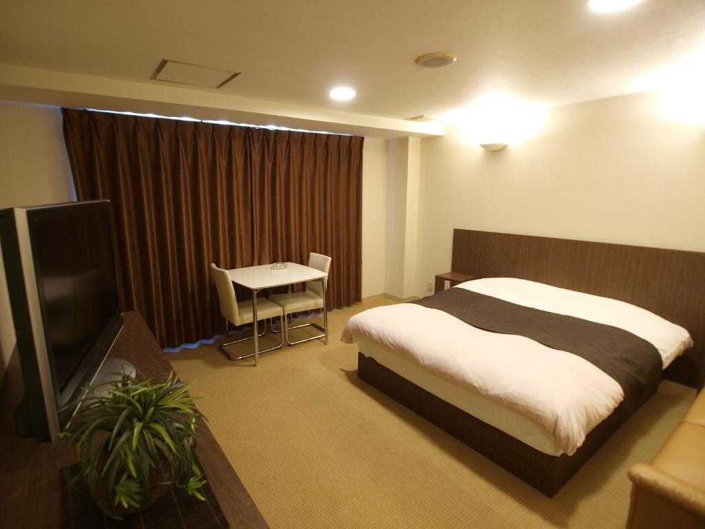 Postel nebo postele na pokoji v ubytování Hotel Le Mont (Adult Only)