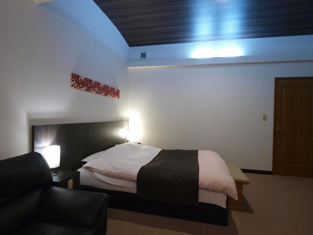 Postel nebo postele na pokoji v ubytování Hotel Le Mont (Adult Only)