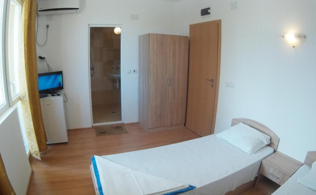 Postel nebo postele na pokoji v ubytování Hotel Aia Kavatsi