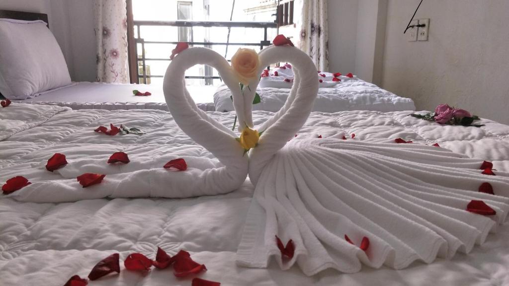 Postel nebo postele na pokoji v ubytování Thanh Huong Homestay Số 7 Hẻm 41 Đường Ngô Quyền, Phường Vĩnh Ninh, Thành phố Huế