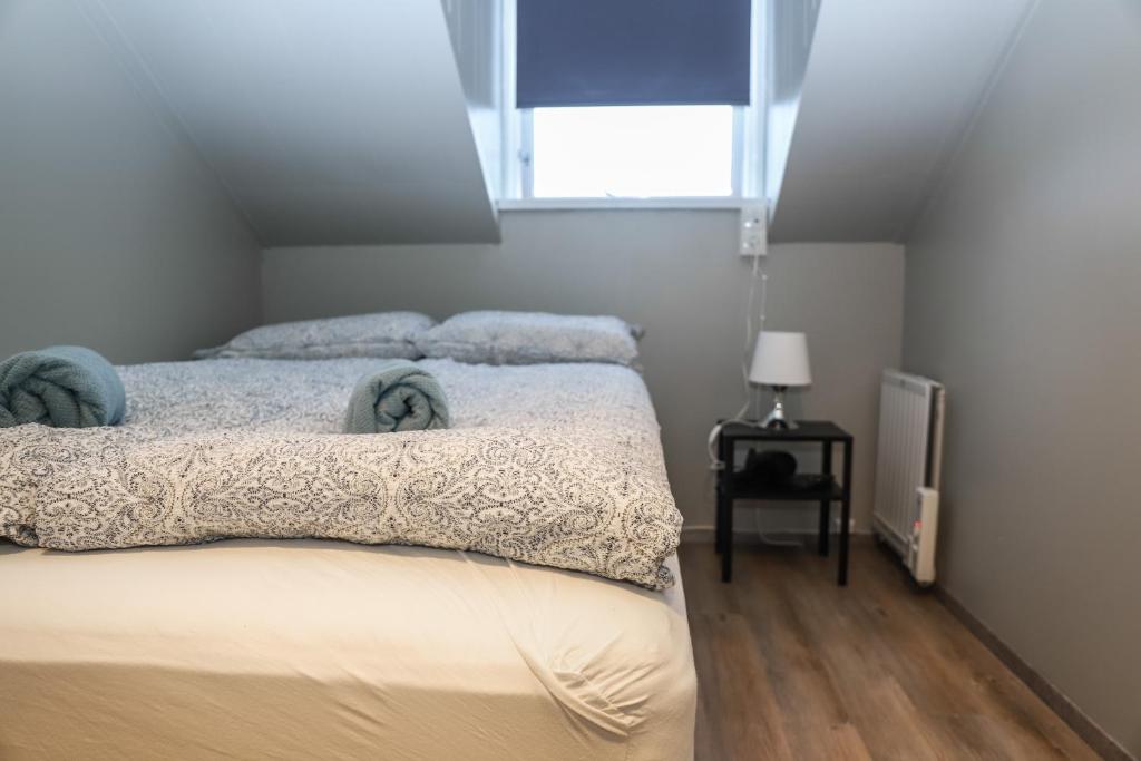 Postel nebo postele na pokoji v ubytování Lava Guesthouse