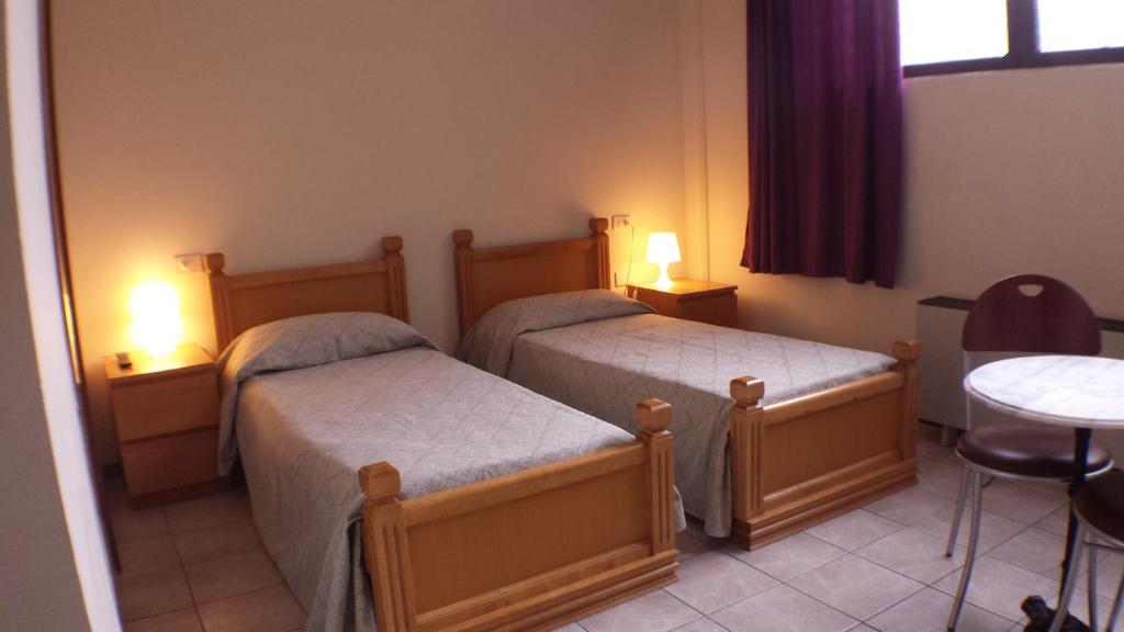 Posteľ alebo postele v izbe v ubytovaní Hotel Firenze 2000