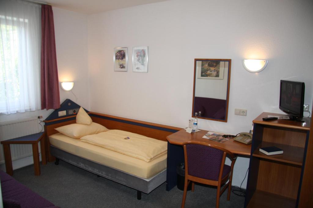 Postel nebo postele na pokoji v ubytování Akzent Hotel Goldener Ochsen