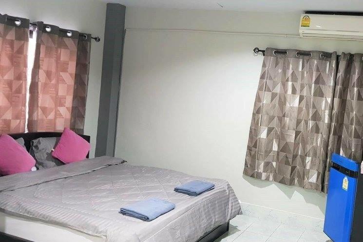 Postel nebo postele na pokoji v ubytování Nit Guest House
