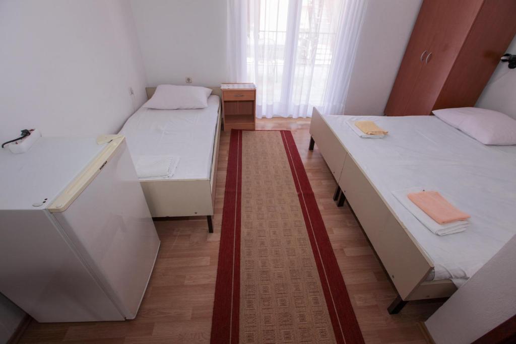 Posteľ alebo postele v izbe v ubytovaní Apartments Adna