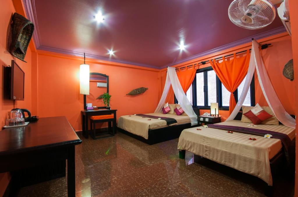 Postel nebo postele na pokoji v ubytování Golden Butterfly Villa