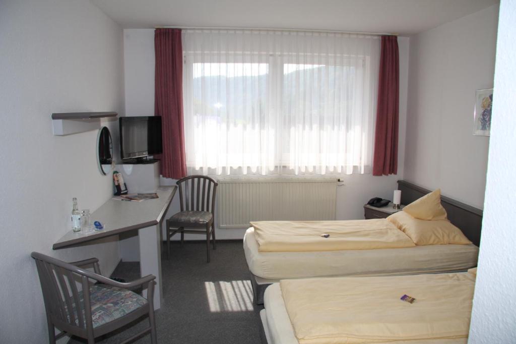 TV a/nebo společenská místnost v ubytování Akzent Hotel Goldener Ochsen
