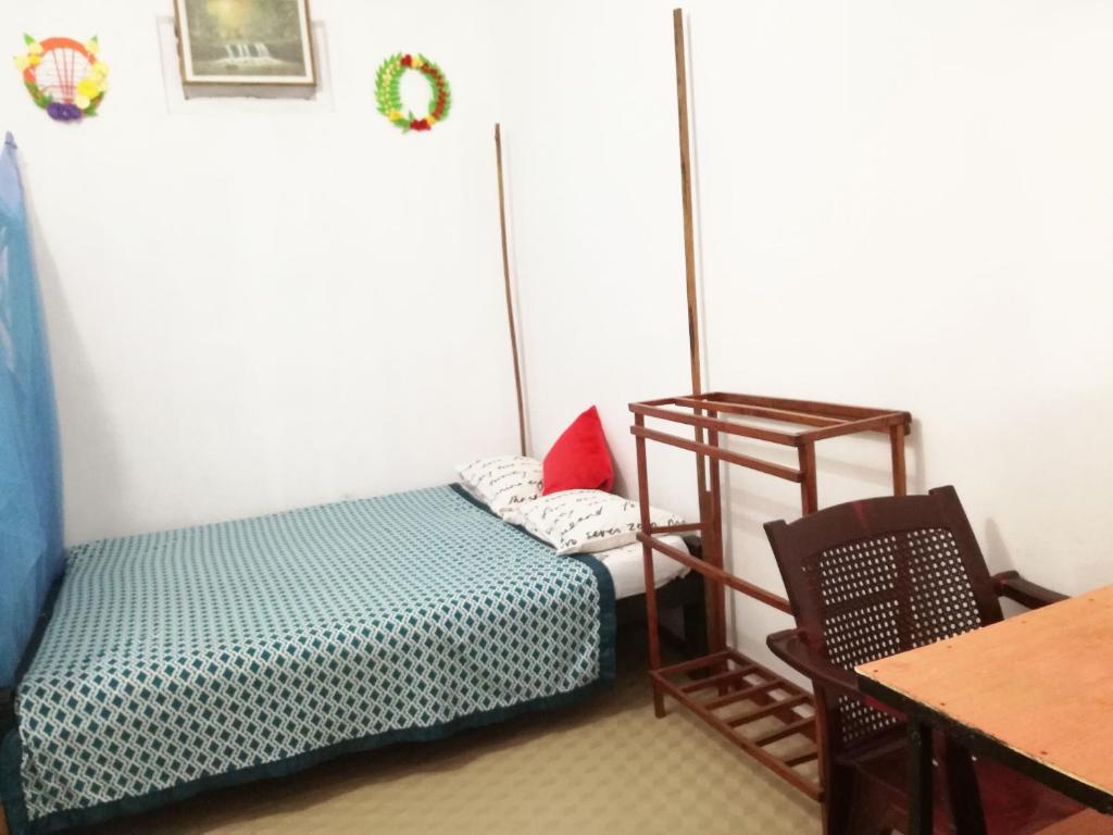 Postel nebo postele na pokoji v ubytování 20 House Arugam