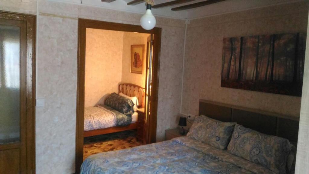 Postel nebo postele na pokoji v ubytování Alojamiento Santa Engracia Laguardia