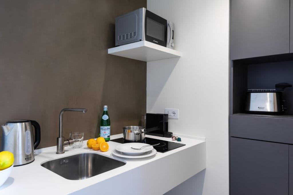 A kitchen or kitchenette at The View Luxury Apartments Taormina