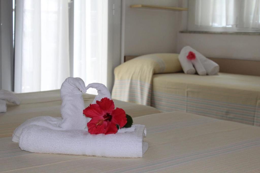 Postel nebo postele na pokoji v ubytování Hotel Erika