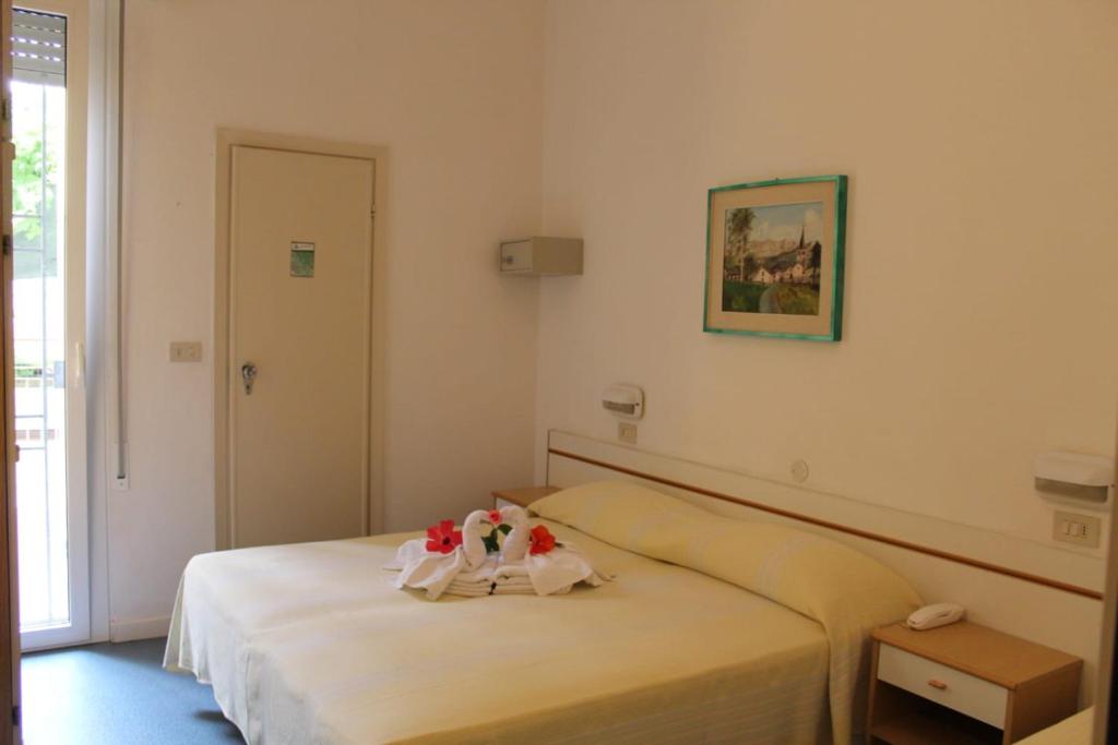 Postel nebo postele na pokoji v ubytování Hotel Erika