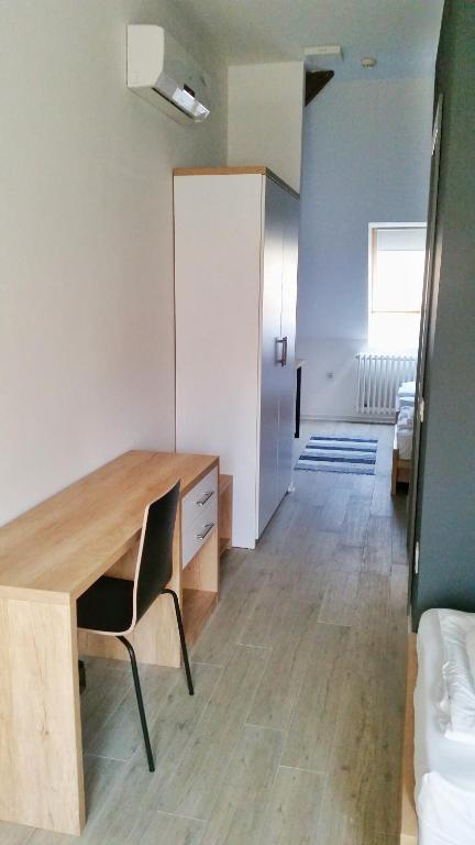 Postel nebo postele na pokoji v ubytování Arhiv Boutique House