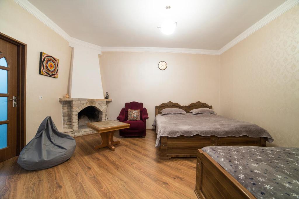 Postel nebo postele na pokoji v ubytování Guest House Khatuna