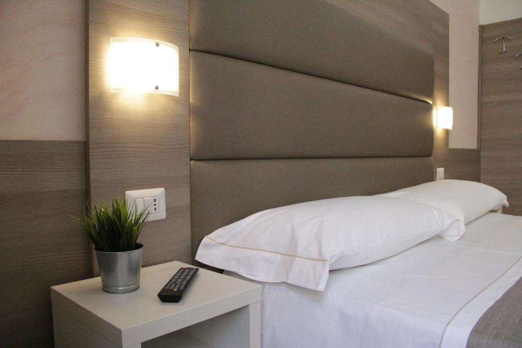 Postel nebo postele na pokoji v ubytování Hotel Siro