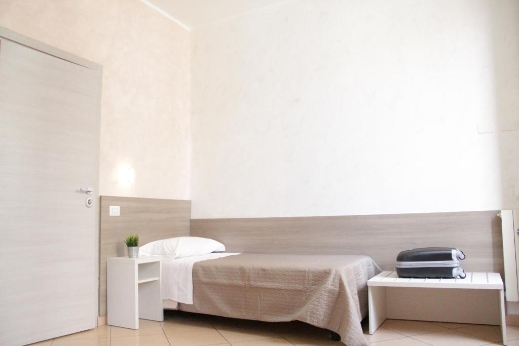 Postel nebo postele na pokoji v ubytování Hotel Siro