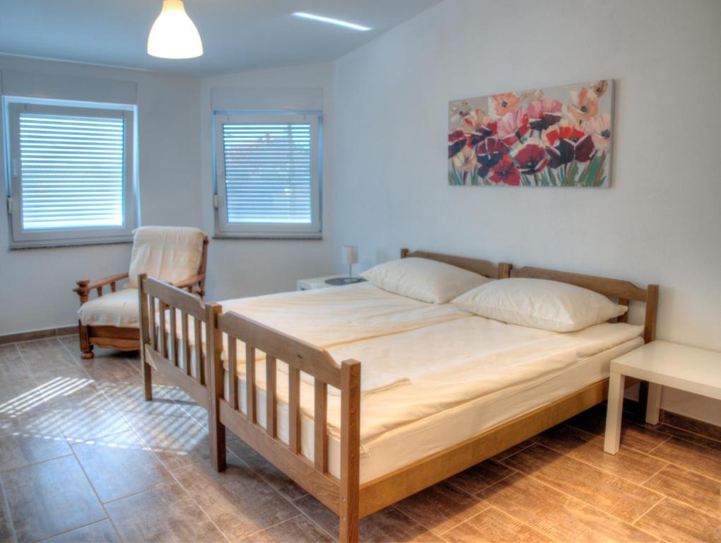 Posteľ alebo postele v izbe v ubytovaní Apartmani Matko