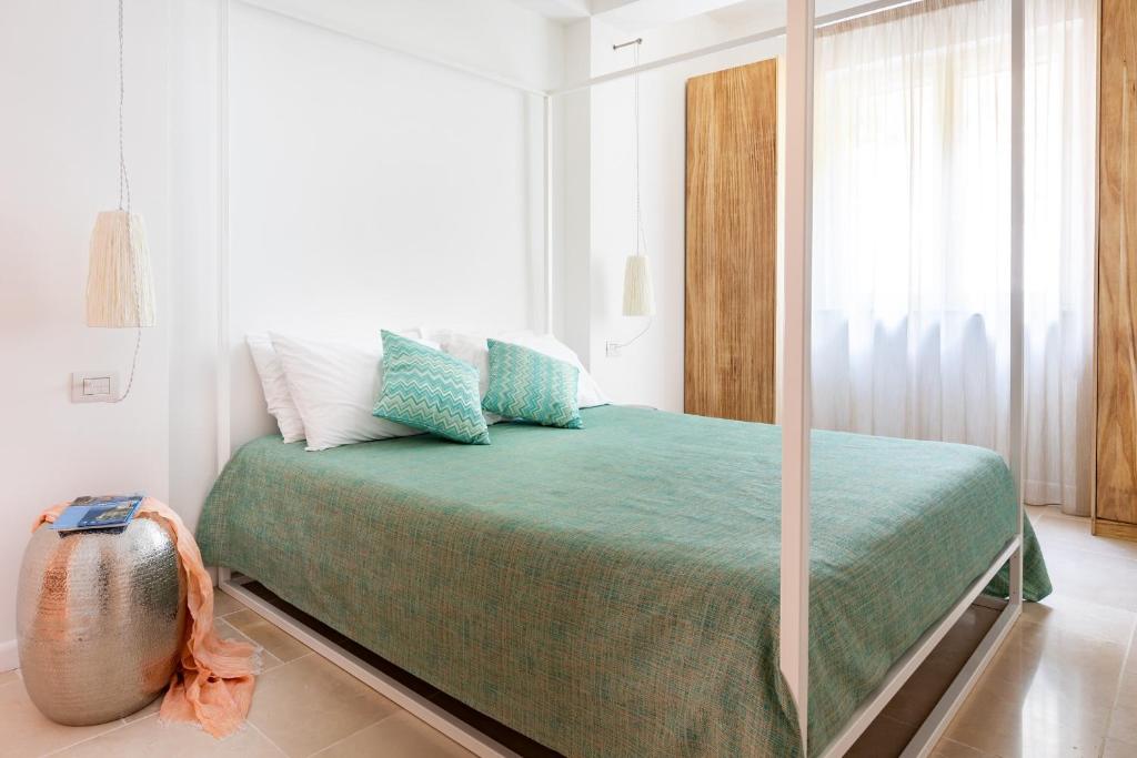 Postel nebo postele na pokoji v ubytování Doneduà B&B